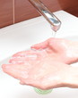 Washing of hands under running water