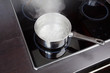Dipper of water on the kitchen stove