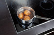 Dipper of water on the kitchen stove