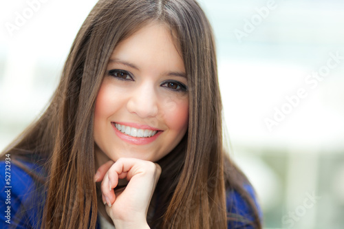 Photo: Beautiful young female executive in a modern setting Beautiful young female executive in a modern setting
