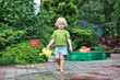 little barefoot girl  with watering can - portrait