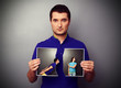 man holding the lacerated photo of young couple