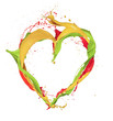 Heart shape made of paint splashes isolated on white