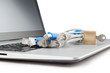 Modern notebook and a group of network cables with lock close-up