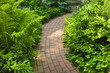 Photo: Brick path in landscaped garden Brick path in landscaped garden