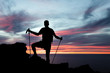 Man hiking silhouette in mountains, ocean and sunset