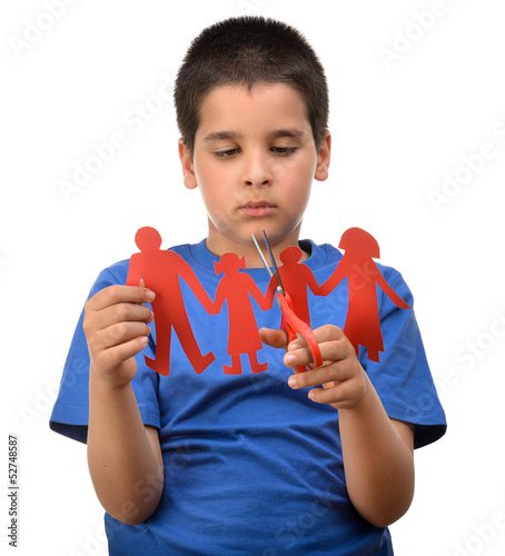 Photo: Divorce effect on kids concept with hands cutting paper family Divorce effect on kids concept with hands cutting paper family