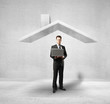 man standing under house roof