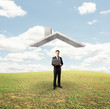 man standing under house roof