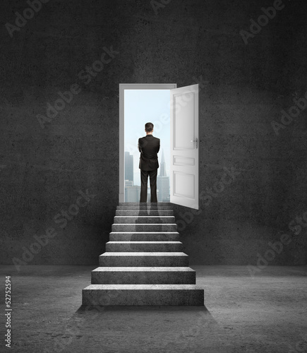 Photo: man and door in wall man and door in wall