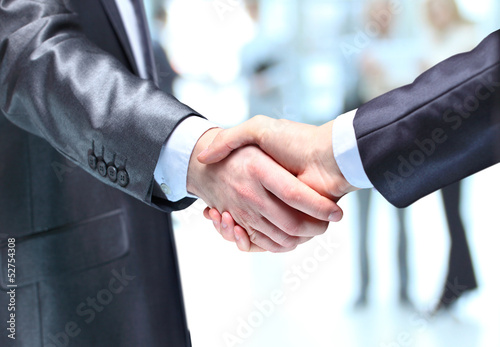 Photo: The businessman. Hand for a handshake. The businessman. Hand for a handshake.