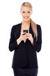 Photo: Happy business woman using cell phone Happy business woman using cell phone