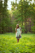Beautiful girl among the wild flowers