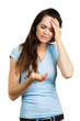 Woman with headache looking at pill