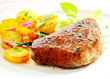 Thick juicy steak with crisp roast potatoes