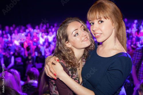 Photo: Two beautiful girls in a party posing for the camera Two beautiful girls in a party posing for the camera