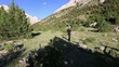Video: hiker walking through valley hiker walking through valley