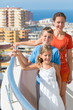Family on the balcony of the room at the hotel
