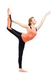 Beautiful sporty woman doing stretching exercise
