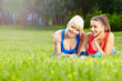 Photo: Portrait of two fitness woman having fun in summer environment Portrait of two fitness woman having fun in summer environment