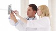 two doctors with x-ray prints