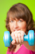 Young woman with dumbbell
