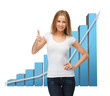 Foto: businesswoman with big 3d chart businesswoman with big 3d chart