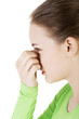 Young woman with sinus pressure pain