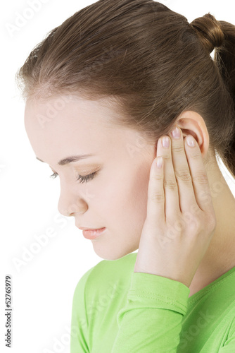 Photo: Young woman feeling a pain in ear Young woman feeling a pain in ear