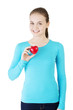 Pretty girl showing red heart