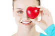 Pretty girl showing red heart