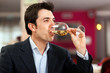 Photo: Man drinking wine at the restaurant Man drinking wine at the restaurant