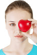 Pretty girl showing red heart