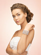 woman with pearl earrings and bracelet