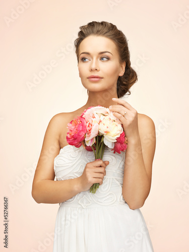 Photo: woman with bouquet of flowers woman with bouquet of flowers