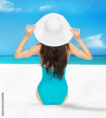 Photo: model posing in swimsuit with hat model posing in swimsuit with hat