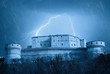 Foto: lightning over the castle in the night lightning over the castle in the night