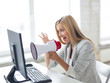 crazy businesswoman shouting in megaphone