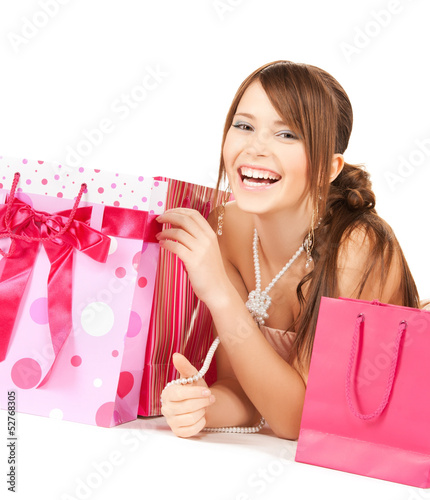 Photo: girl with colorful gift bags girl with colorful gift bags
