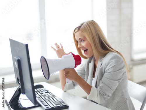 Photo: crazy businesswoman shouting in megaphone crazy businesswoman shouting in megaphone