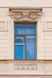 A window with a bas-relief.