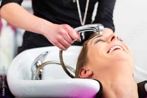 Photo: Woman at the hairdresser washing hair Woman at the hairdresser washing hair