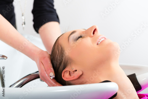 Photo: Woman at the hairdresser washing hair Woman at the hairdresser washing hair