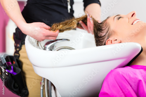 Photo: Woman at the hairdresser washing hair Woman at the hairdresser washing hair