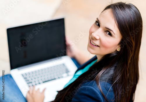Photo: Woman working on a laptop Woman working on a laptop