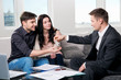 Happy couple with real estate agent