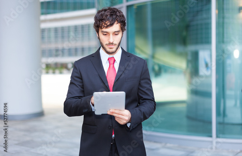 Photo: Businessman using a tablet Businessman using a tablet