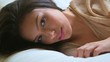 Beautiful latina woman lying in bed