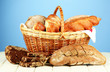 Composition with bread and rolls, in wicker basket