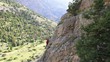 female climber climbing mountain
